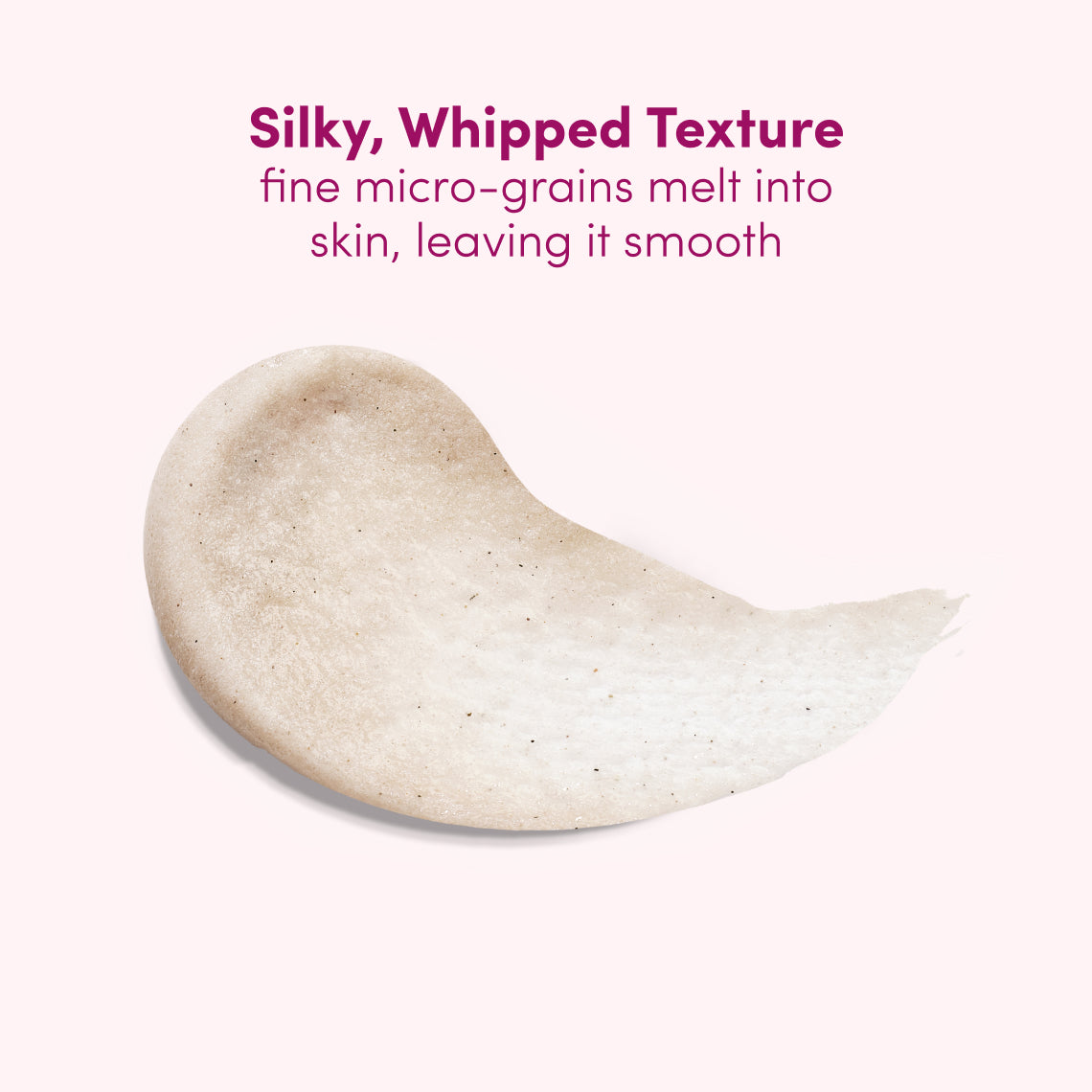 A smear of creamy beige cosmetic product on a pale pink background with text reading 'Silky, Whipped Texture' and 'fine micro-grains melt into skin, leaving it smooth'.