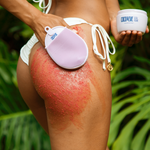woman in bathing suit using silicone massage glove to exfoliate with bali buffing sugar - 2